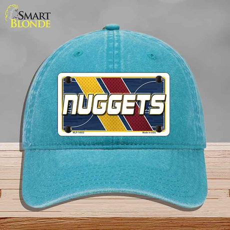 Blue cap with a 'NUGGETS' license plate design on a gray background