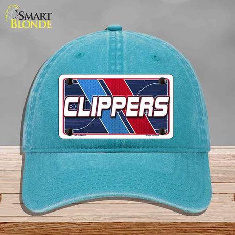 Blue cap with Clippers logo on a gray background