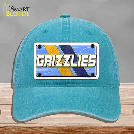 Blue cap with 'GRIZZLIES' logo on a gray background