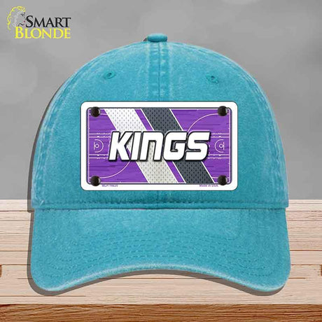 Blue cap with a 'KINGS' logo on a gray background