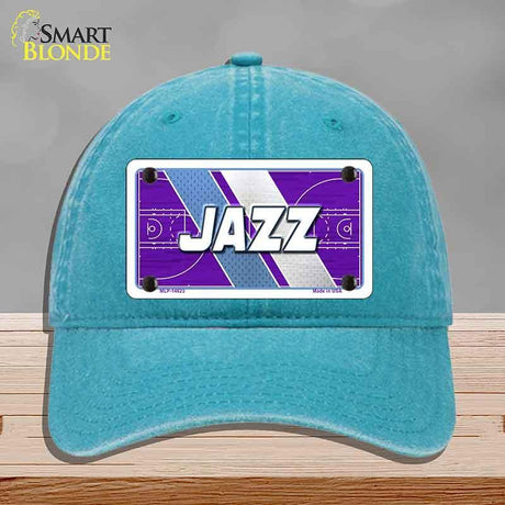 Turquoise cap with a 'Jazz' logo on a gray background