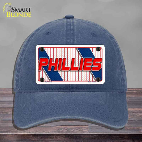 Blue cap with Phillies logo on a gray background