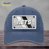 Blue cap with 'NETS' logo on a gray background