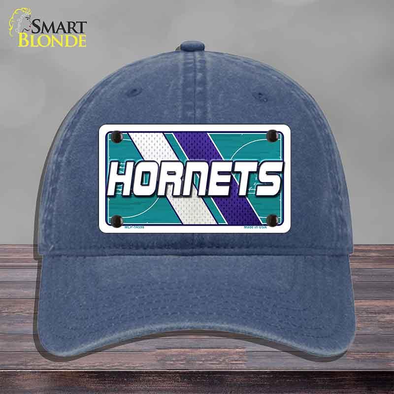 Blue cap with Hornets logo on a gray background