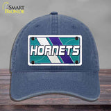 Blue cap with Hornets logo on a gray background