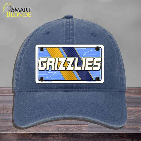 Blue cap with 'GRIZZLIES' logo on a gray background
