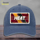 Blue cap with 'HEAT' design on a gray background