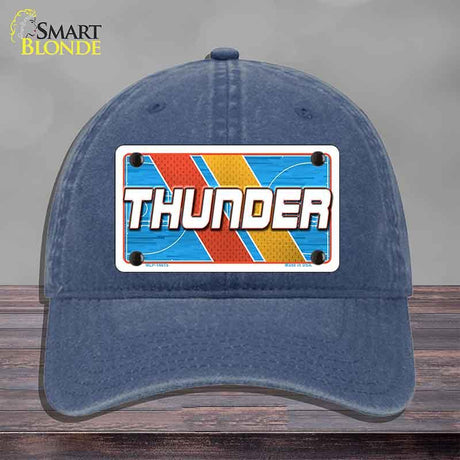 Blue cap with a 'THUNDER' license plate design on a gray background