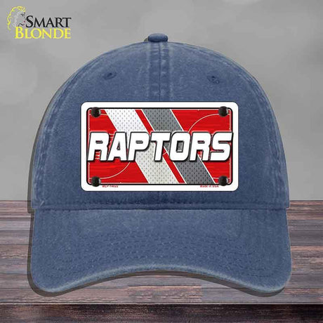 Blue cap with a 'Raptors' logo on a gray background