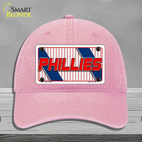 Pink cap with Phillies logo on a gray background