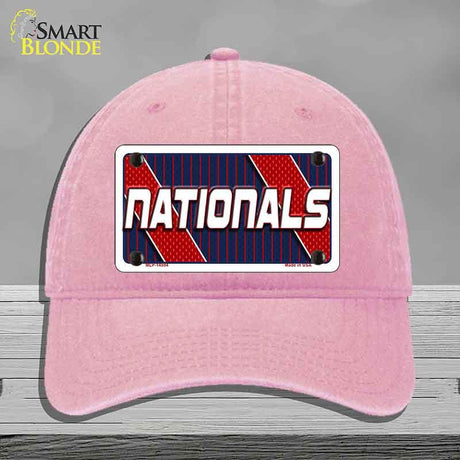 Pink cap with 'NATIONALS' logo on a gray background
