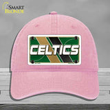 Pink cap with Celtics logo on a gray background