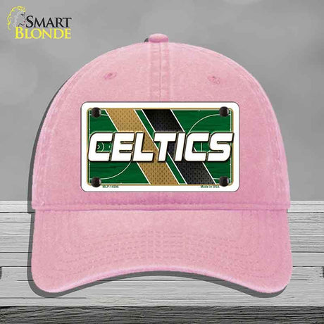Pink cap with Celtics logo on a gray background