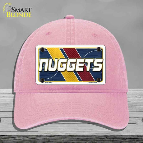 Pink cap with a 'NUGGETS' license plate design on a gray background