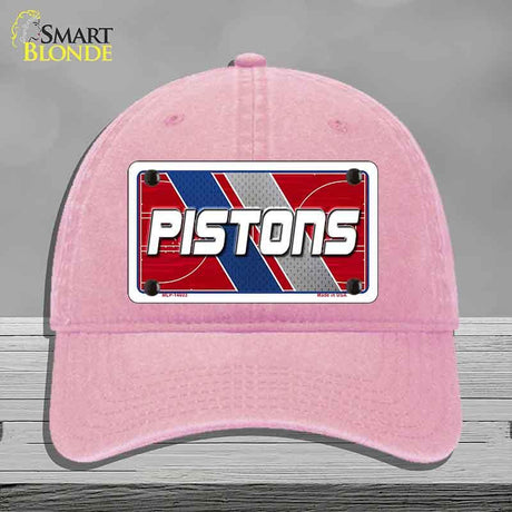 Pink cap with 'PISTONS' logo on a gray background