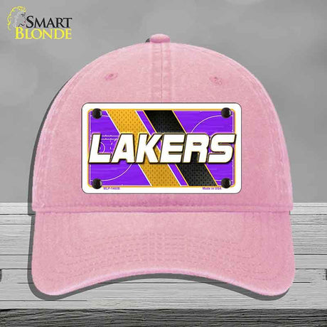 Pink cap with Lakers logo on a gray background