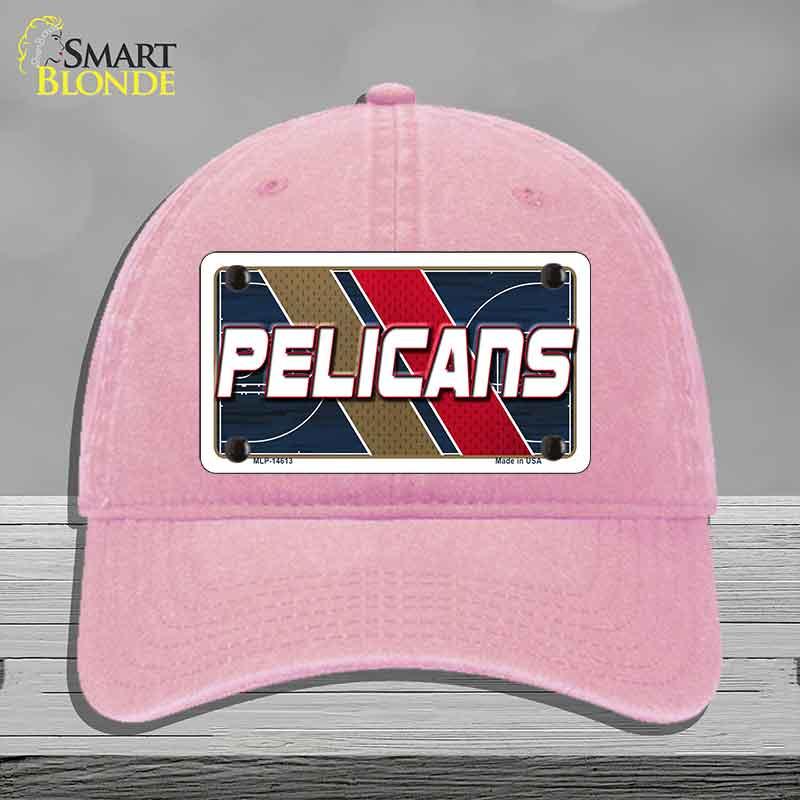 Pink cap with 'Pelicans' logo on a gray background