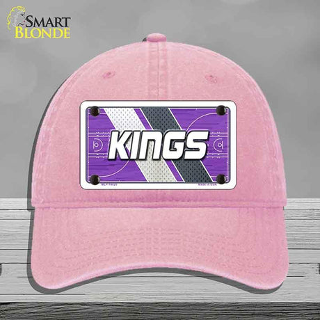 Pink cap with 'KINGS' logo on a gray background