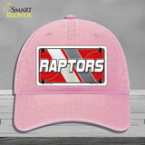 Pink cap with 'RAPTORS' logo on a gray background