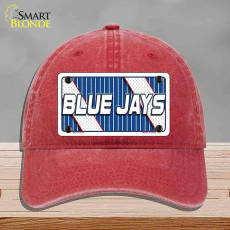Red cap with 'Blue Jays' logo on a gray background
