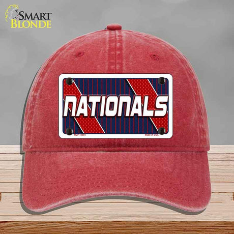 Red cap with 'Nationals' logo on a gray background