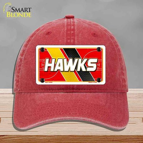 Red cap with a 'HAWKS' license plate design on a gray background