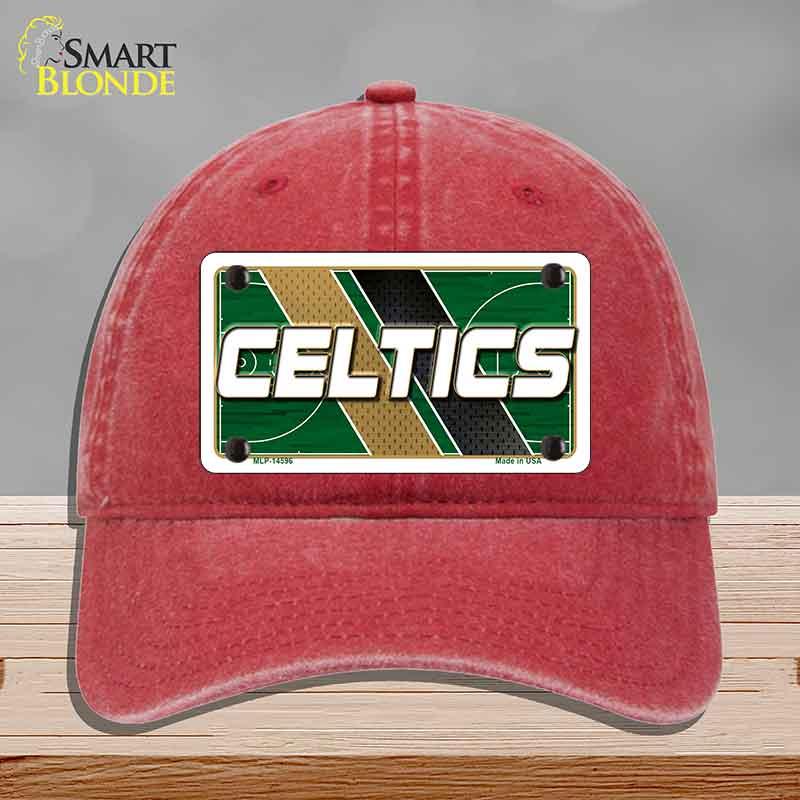 Red cap with Celtics logo on a gray background