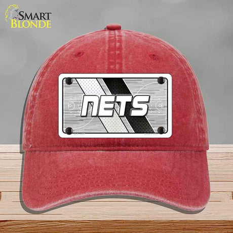 Red cap with 'NETS' logo on a gray background