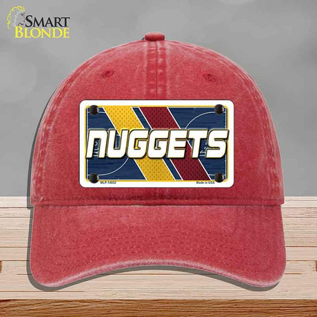 Red cap with a 'NUGGETS' logo on a gray background