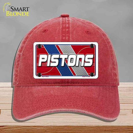Red cap with 'PISTONS' logo on a gray background