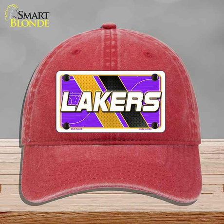 Red cap with Lakers logo on a gray background