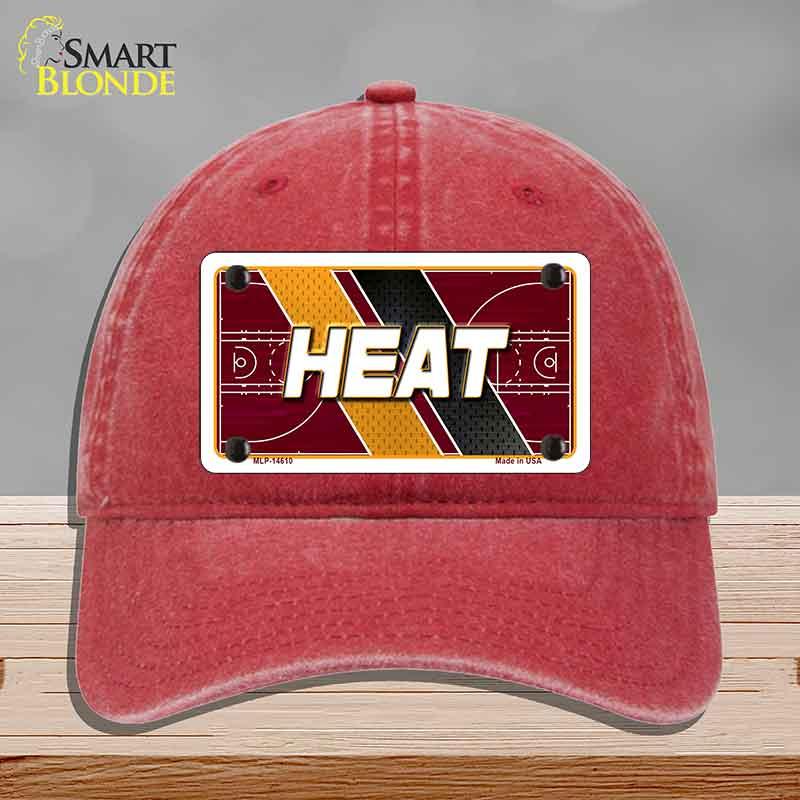 Red cap with 'HEAT' design on a gray background