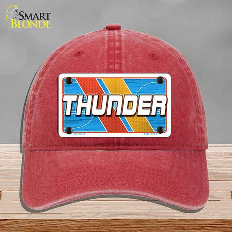 Red cap with a 'THUNDER' license plate design on a gray background