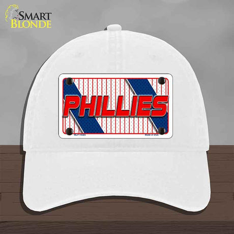 White cap with Phillies logo on a gray background