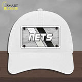 White cap with 'NETS' logo on a gray background