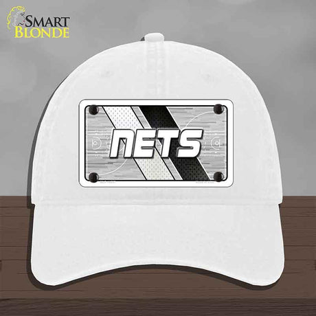 White cap with 'NETS' logo on a gray background