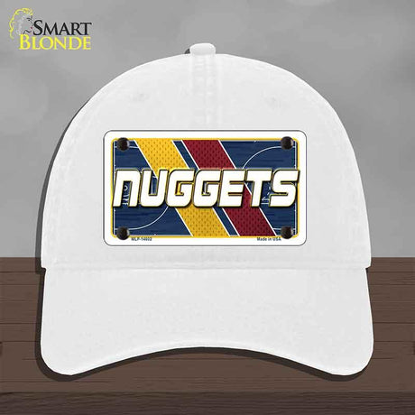 White cap with 'NUGGETS' design on a gray background