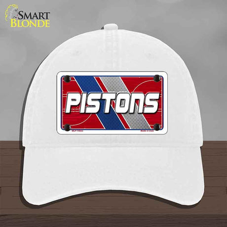 White cap with Pistons logo on a gray background