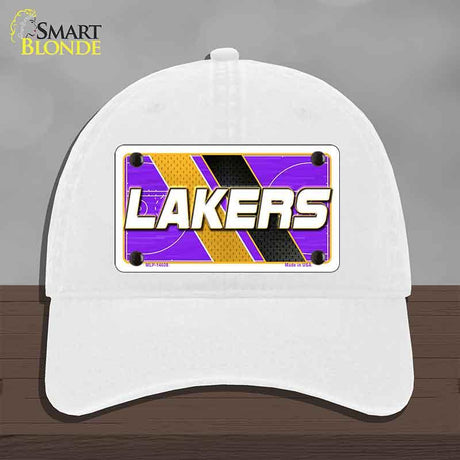 White cap with Lakers logo on a gray background