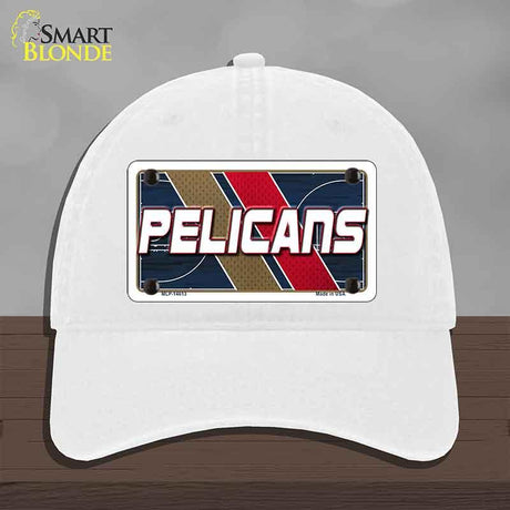 White cap with 'Pelicans' design on a gray background
