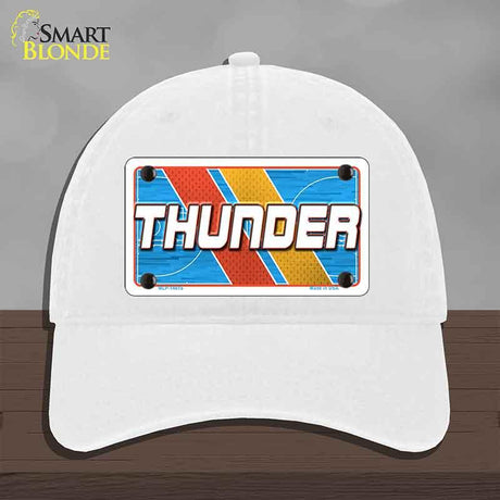 White cap with 'THUNDER' design on a gray background