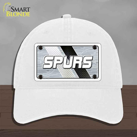 White cap with 'SPURS' logo on a gray background