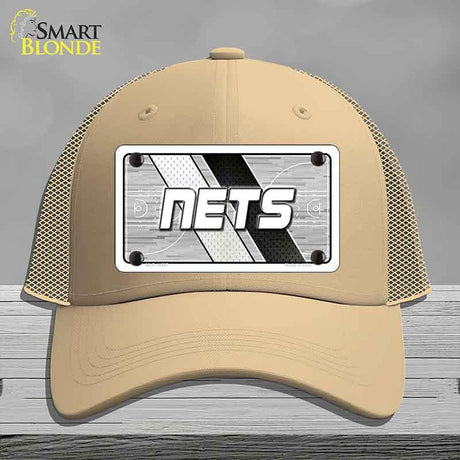 Beige cap with 'NETS' logo on a gray background