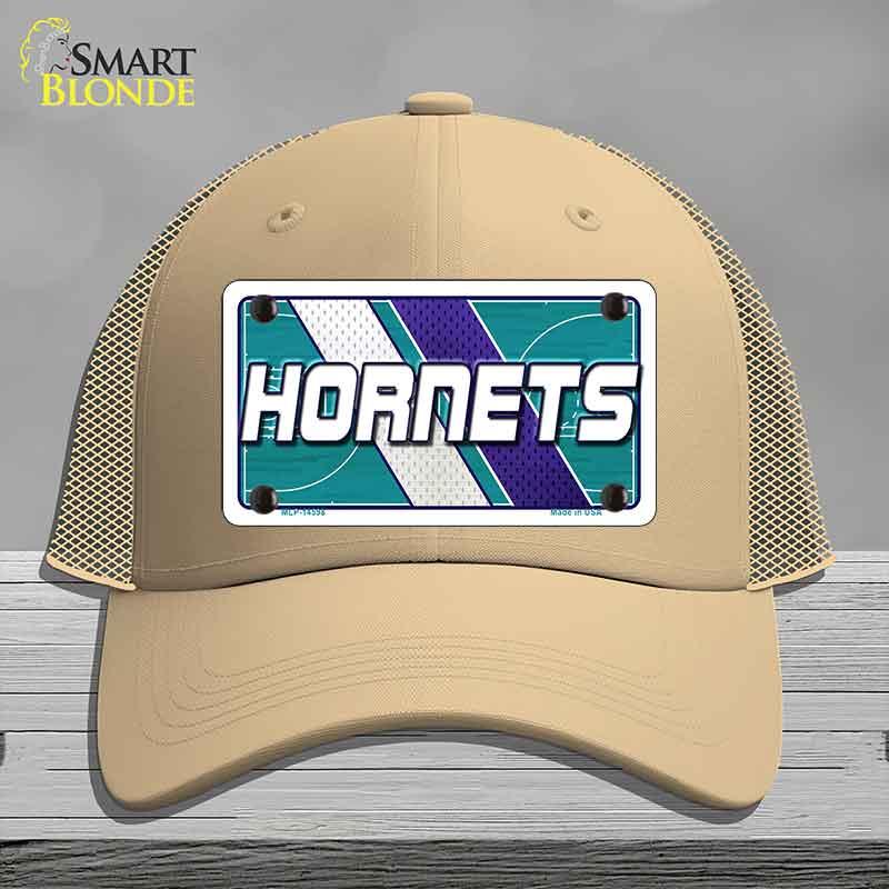 Beige cap with Hornets logo on a gray background