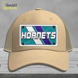 Beige cap with Hornets logo on a gray background