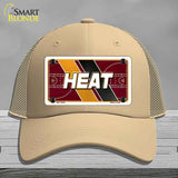 Beige cap with 'HEAT' design on a gray background