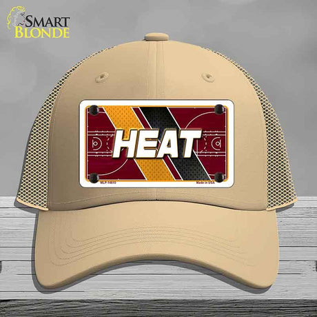 Beige cap with 'HEAT' design on a gray background