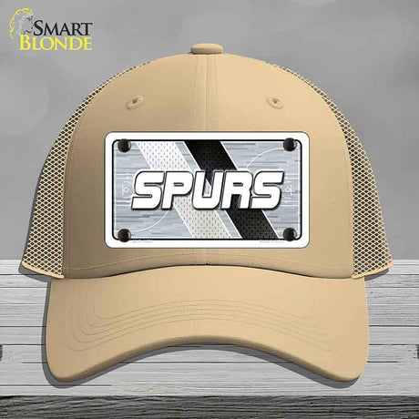 Beige cap with 'SPURS' logo on a gray background