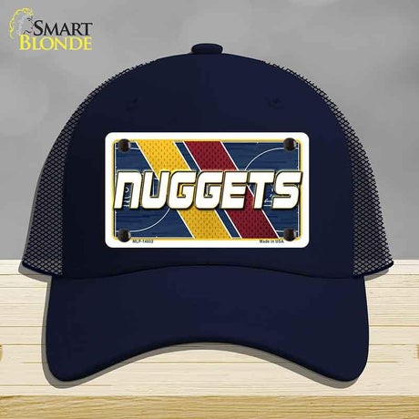 Navy blue cap with 'NUGGETS' design on a gray background