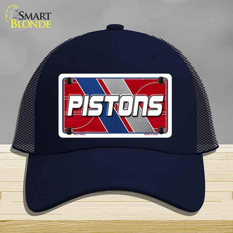 Navy blue cap with 'PISTONS' logo on a gray background